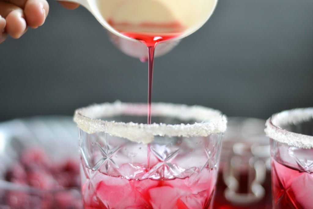 making a cranberry vodka spritzer