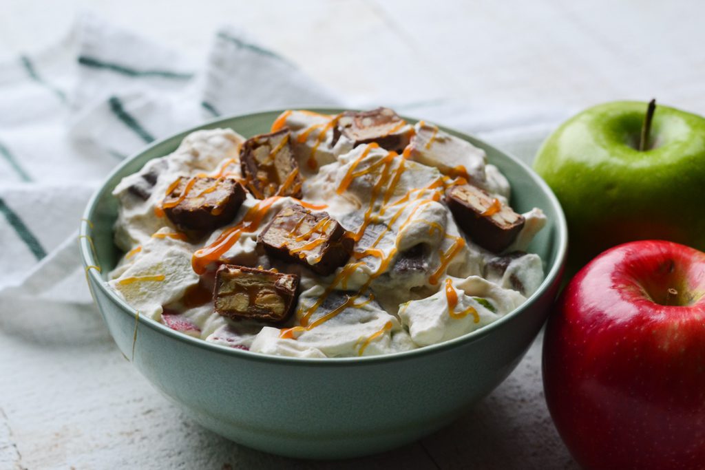 Caramel Apple Snickers Salad with caramel drizzled on top
