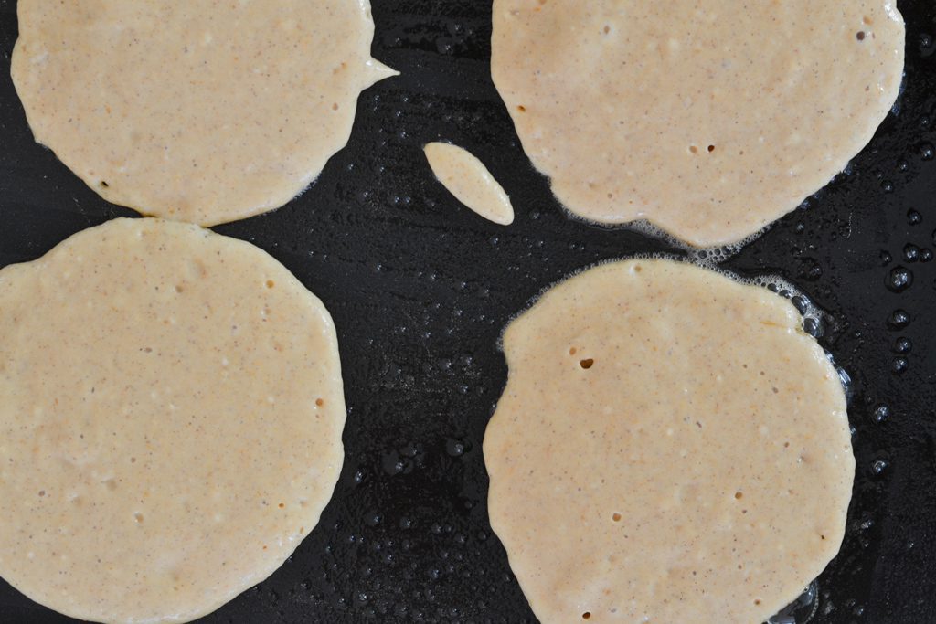 pumpkin pancakes on a griddle