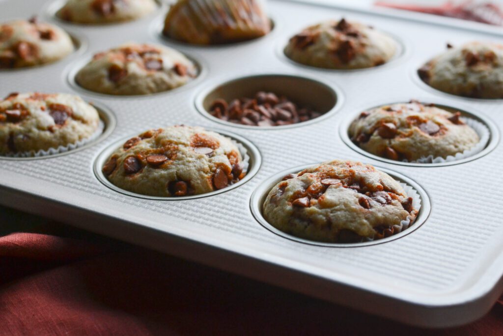Cinnamon Chip Muffins in a muffin tin