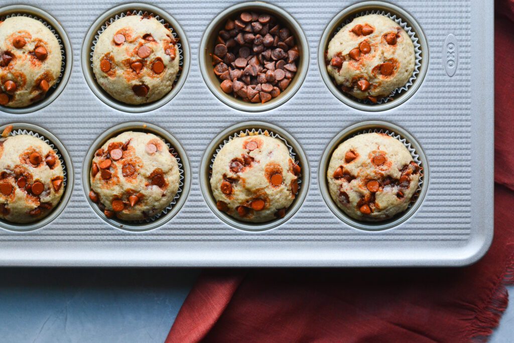 Cinnamon Chip Muffins in a muffin tin