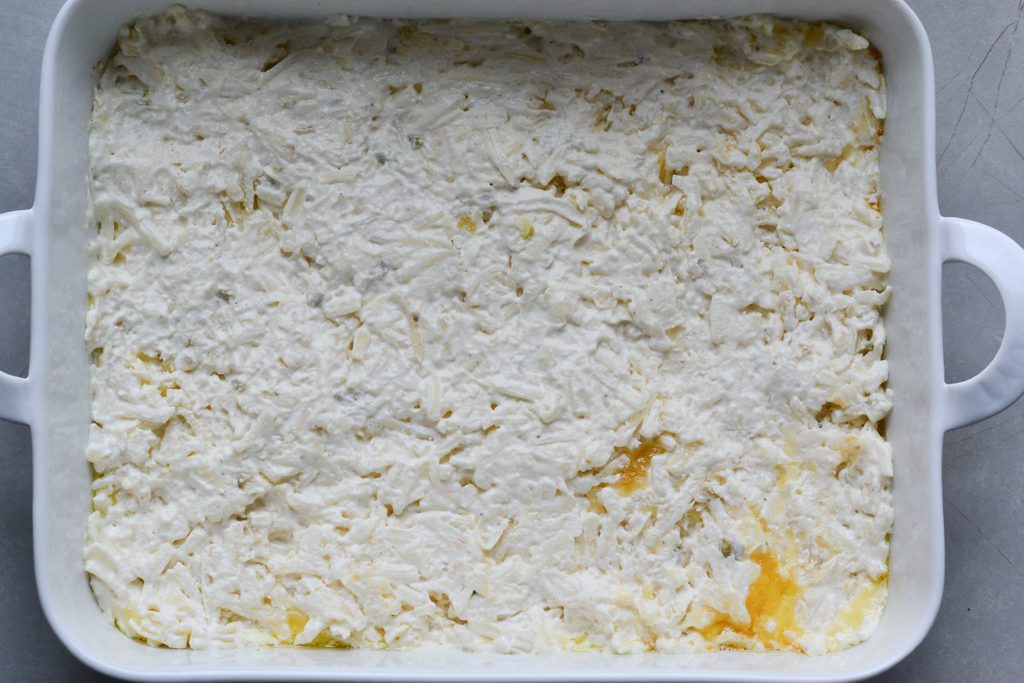 hashbrowns spread in a baking dish