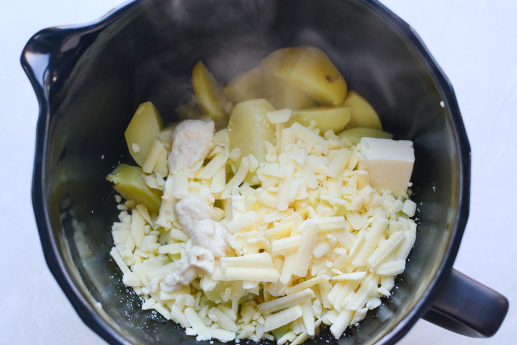 cooked potatoes, cheese, cream, and butter in a stand mixer. 